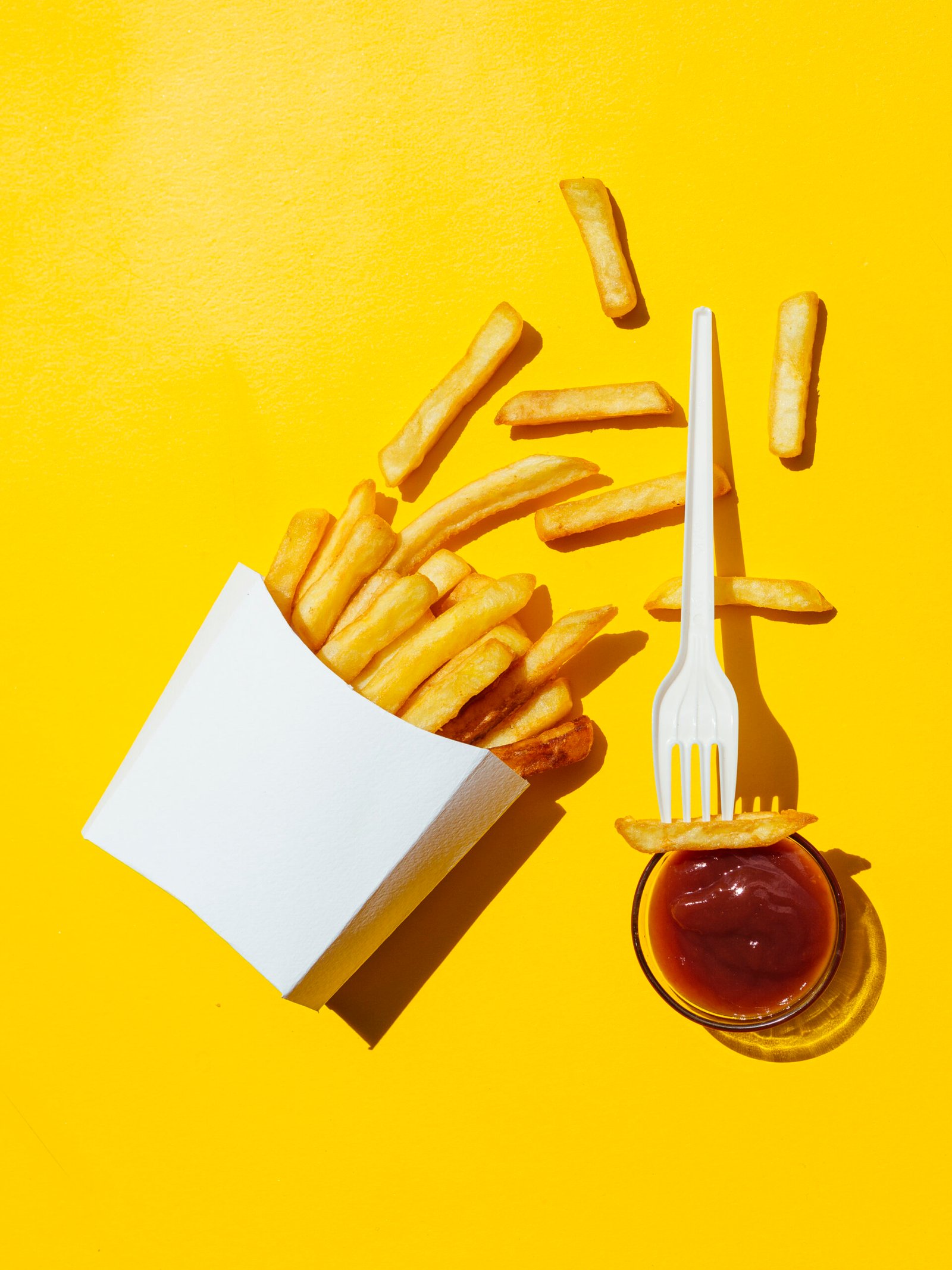 spilled-box-fries-with-ketchup-fork spilled-box-fries-with-ketchup-fork